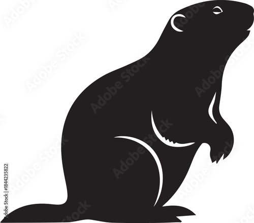 Black silhouette of a groundhog standing on hind legs