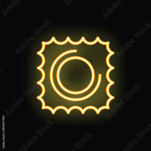 Bright yellow neon sign of a condom glowing on a black background
