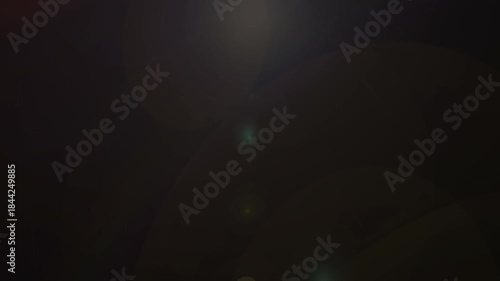 Real anamorphic light leak transition. Bokeh lens flare transition on black background.