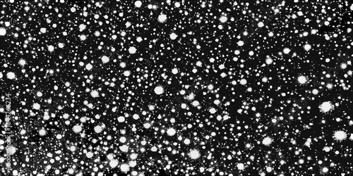 A black background filled with scattered bright white irregularly shaped spots