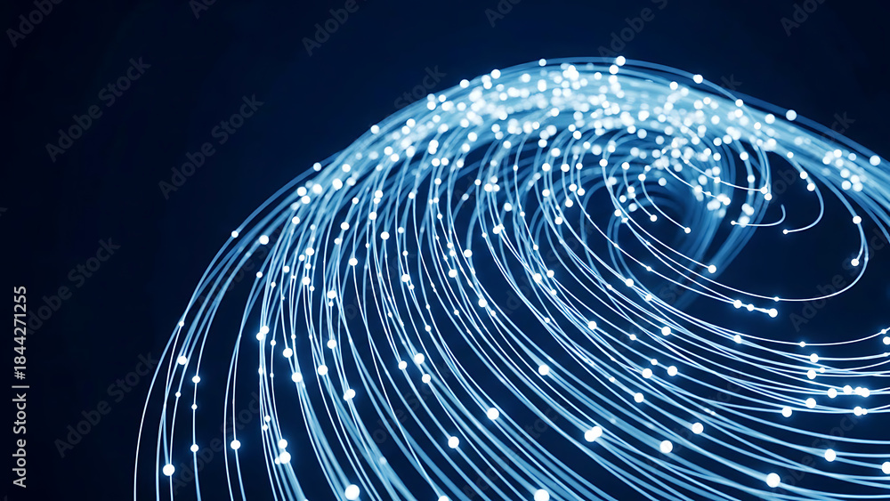 Obraz premium Glowing blue fiber optic light trails in a swirling pattern on a dark background