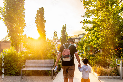 Photos Father and son walking at sunset in vancouver, british columbia