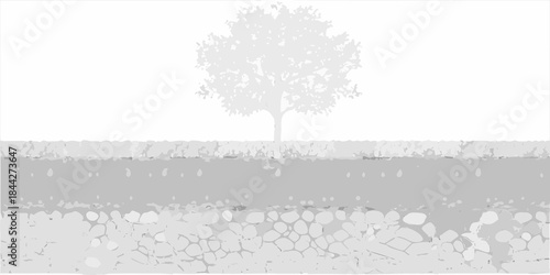 A solitary tree stands against a gray textured landscape with gravel foreground