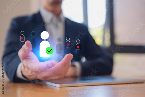 Business professional choosing approved candidate from multiple applicants with digital icons, representing recruitment, hiring decision, human resources management and employee selection technology