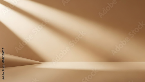 Warm light beams illuminate an empty, minimalist studio space, casting dynamic shadows across the neutral beige wall and floor, creating an elegant backdrop for product display or abstract concepts