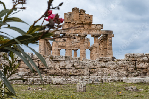 Historic Greek ruins of Athena Temple in Paestum on overcast day