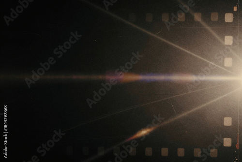 Film strip with a bright light shining through it.