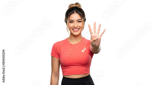Smiling athletic woman confidently showing four fingers, symbolizing options, progress, or numerical achievements in a healthy and active lifestyle