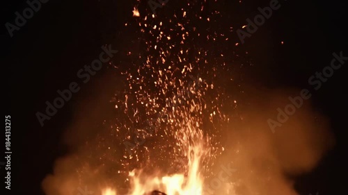 Mesmerizing Slow Motion Bonfire with Flying Embers at Night.