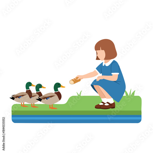 A girl kneels to feed bread to three ducks on a green bank near a blue water area