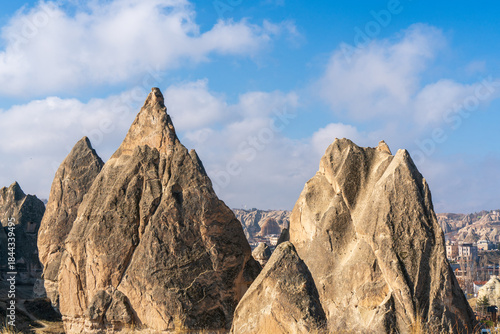 Bild auf Leinwand Tall fairy chimney rock formations in Cappadocia Turkey with cloudy sky