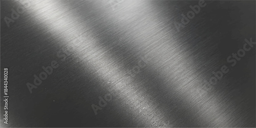 Brushed silver metal texture background shows a polished metallic aluminum plate surface with a shiny stainless steel pattern and light gray reflection