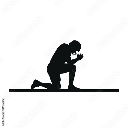 Silhouette of a football player kneeling in prayer or reflection on a white background.