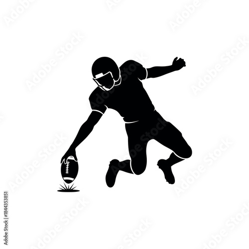 Silhouette of American Football Player Kicking Ball.