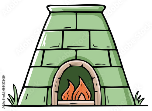 Green brick kiln with flames inside and grass on the sides