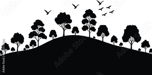 Black silhouette of trees and birds on a hill