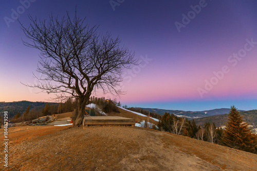 Fototapeta Naklejka Na Ścianę i Meble -  Vibrant dawn sky over hilly rural Beskid Mountains landscape, natural background or nature wallpaper, Poland