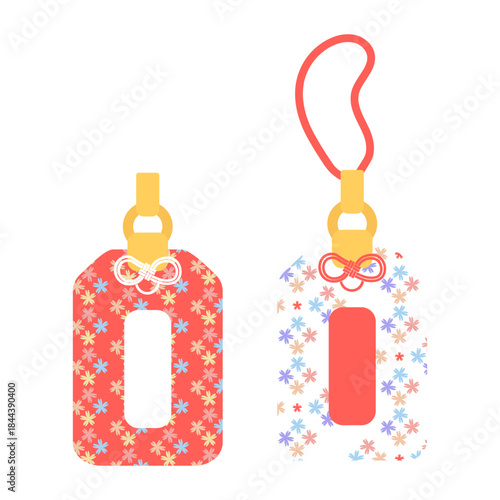 Two Japanese omamori in pink and white to bring good luck. Can be used as decoration and as a symbol of luck.