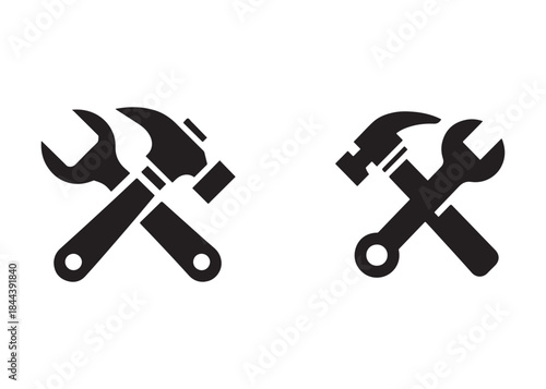 hammer and wrench logo silhouette vector, hand tool logo silhouette illustration, construction equipment logo, repair service wrench crossed over a hammer logo silhouettes vector on white background 