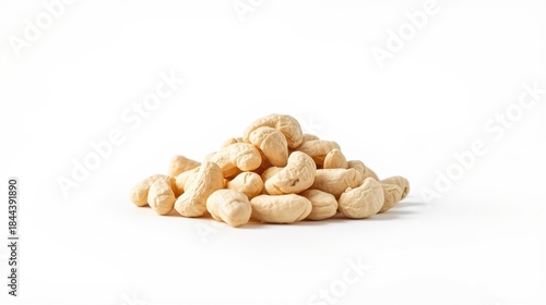 Closeup of raw cashews arranged in a small neat pile on white background for healthy snacking and cooking