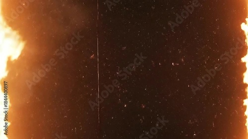 Fiery Abstract Background with Glowing Embers and Light Flares.