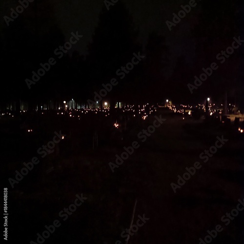 Candle lights in a cemetery at night