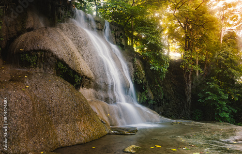 Beautiful tropical waterfall Sai Yok Noi located in Kanchanaburi National Park in western Thailand, surrounded by lush green forest, rocks, and flowing freshwater, popular natural travel destination