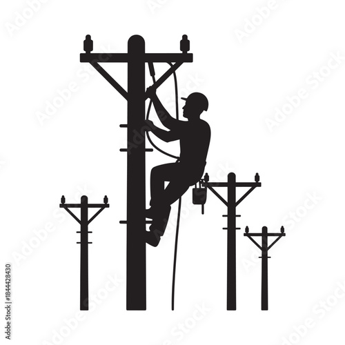 Silhouette of a lineman working on high voltage power lines and poles