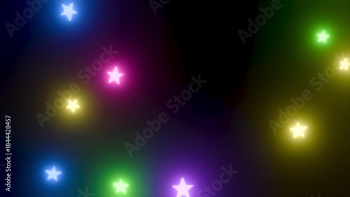 回転しながら落下するカラフルな星