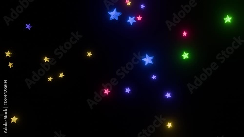 回転しながら落下するカラフルな星