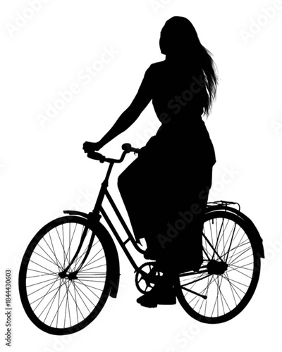 Young woman riding a bicycle outdoors on a sunny day.
