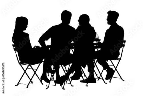 Four people enjoying a meal together at an outdoor cafe on a sunny day.