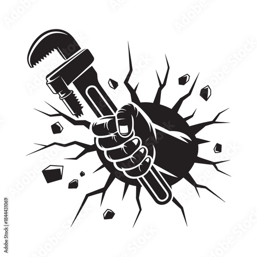 A hand firmly gripping a wrench breaking through a cracked wall