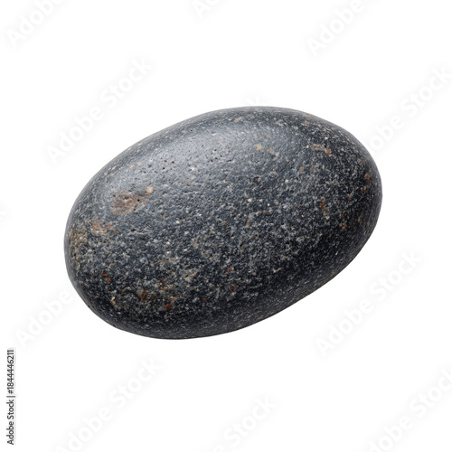 Round Black Stone With Light Streaks Placed on a White Surface