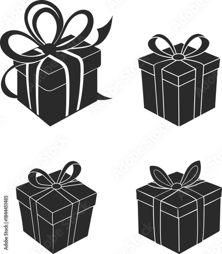 Four black and white gift boxes with ribbons and bows
