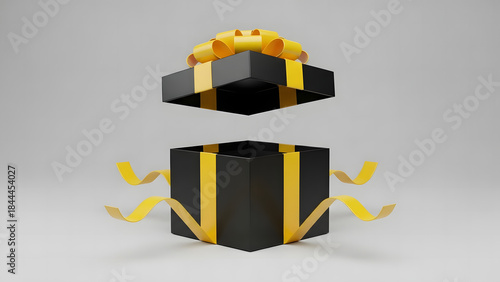 Gift box, open with gold ribbon and bow