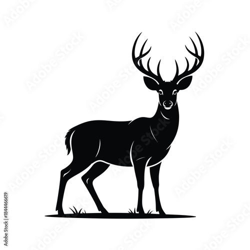 A striking black silhouette of a majestic stag standing in profile