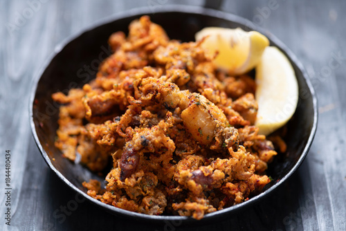 pan of crispy fried baby calamari side dish