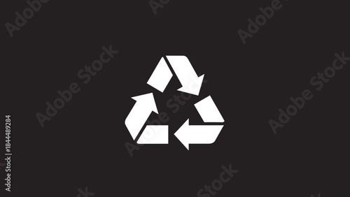 Recycle symbol on a dark background.