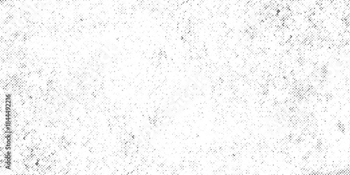 Halftone faded gradient texture. Grunge halftone grit background. White and black sand noise wallpaper.