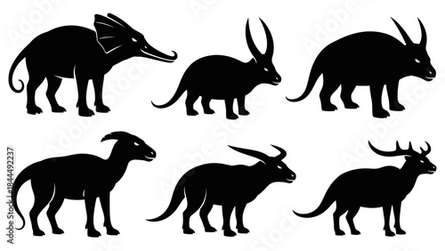 A Collection of Stylized Black Silhouettes of Ancient Creatures and Mammals on a White Background