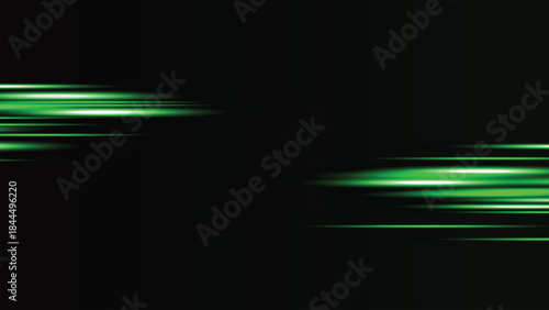 Green neon light streaks on a black background with motion blur effect