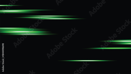 Green neon light streaks on a dark background with motion blur effect