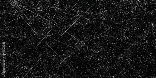 A seamless black leather and dark fabric texture features a rough grunge material surface with a natural vintage textile pattern for a macro wallpaper backdrop