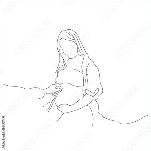 the doctor checks the pregnant woman's stomach. Doctor examining a pregnant woman