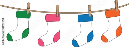 Colorful Christmas Stockings Hanging on a Clothesline with Clothespins Keywords: Christmas, stockings, hanging, clothesline