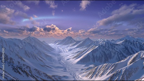 Majestic mountain sunrise over snowy peaks with clouds and expansive valleys