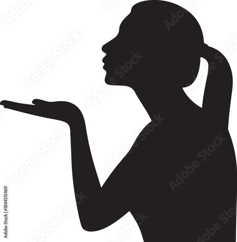 Silhouette of a woman blowing a kiss with open hand gesture