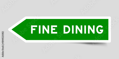 Green color arrow shape sticker label with word fine dining on gray background