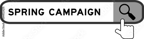 Search banner in word spring camapign with hand over magnifier icon on white background